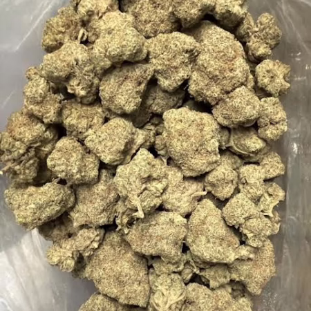 Close-up view of Pegasus Poop flower. Premium cannabis buds, showcasing the dense, frosty quality of the product. Perfect for discerning consumers.