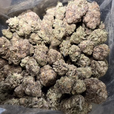 Close-up of Super Boof cannabis buds showcasing their rich texture and color, ideal for connoisseurs seeking quality.