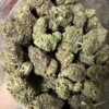 Premium Hindu Kush cannabis strain featuring dense, aromatic buds with a rich green hue, ideal for relaxation and stress relief.