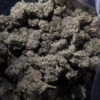 Close-up of Bubba OG cannabis buds showcasing their dense structure and rich green color, ideal for connoisseurs.