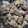 Close-up of Cookies Kush cannabis buds showcasing rich colors and textures, ideal for connoisseurs seeking quality.