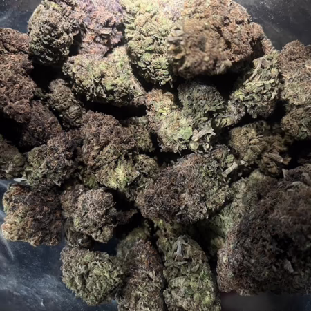 A close-up view of Love Potion cannabis buds, showcasing their rich colors and textures, ideal for enhancing relaxation and romance.