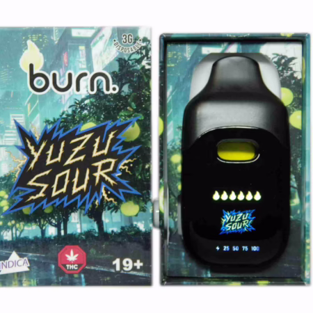 Burn Disposable Pen 3g - Yuzu Sour vape device shown next to its branded packaging featuring a city street scene and citrus fruit imagery.